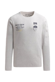 Sweter z nadrukiem, naszywkami i kieszenią na rękawie