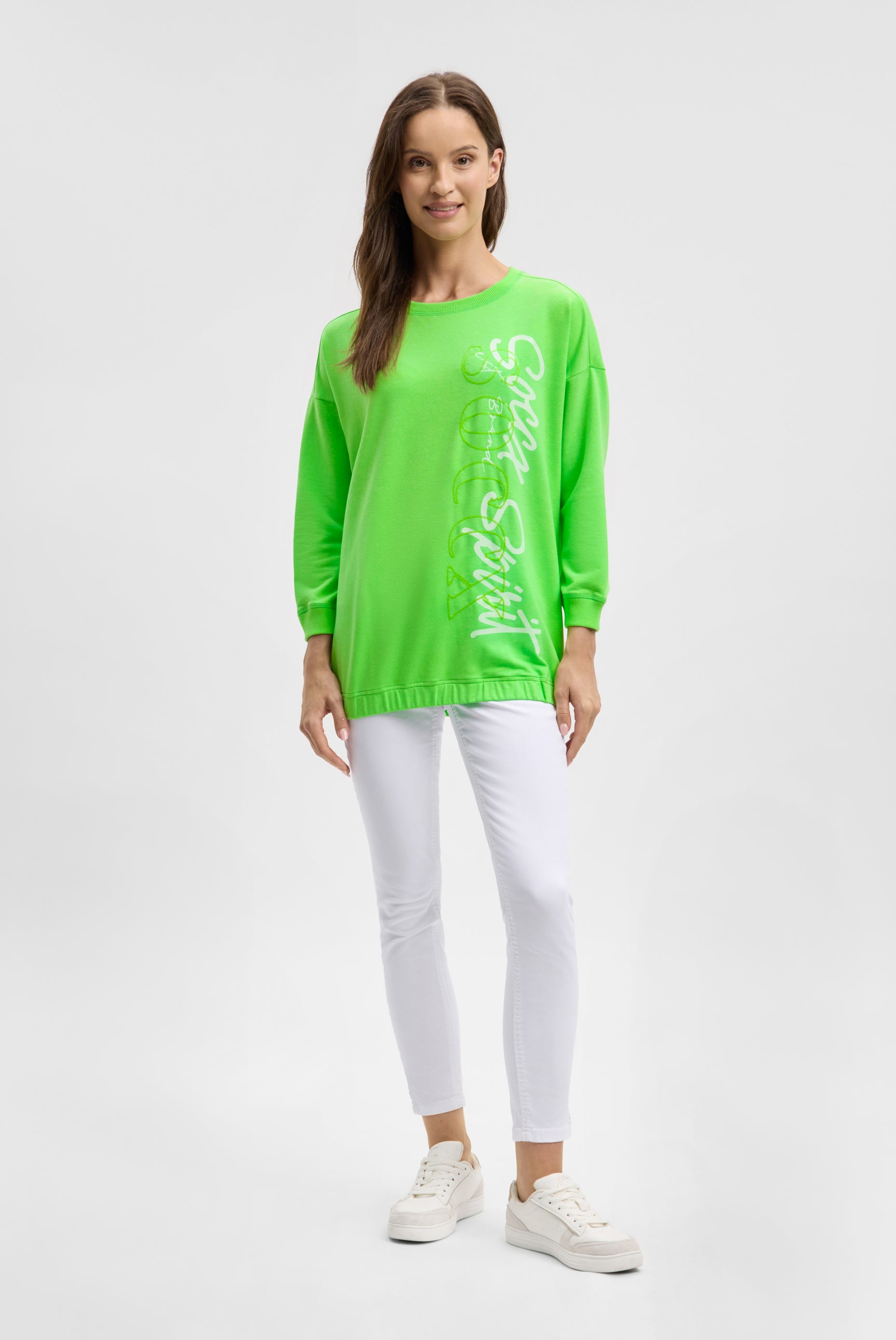 Bluza z gumką u dołu i logo z cekinów