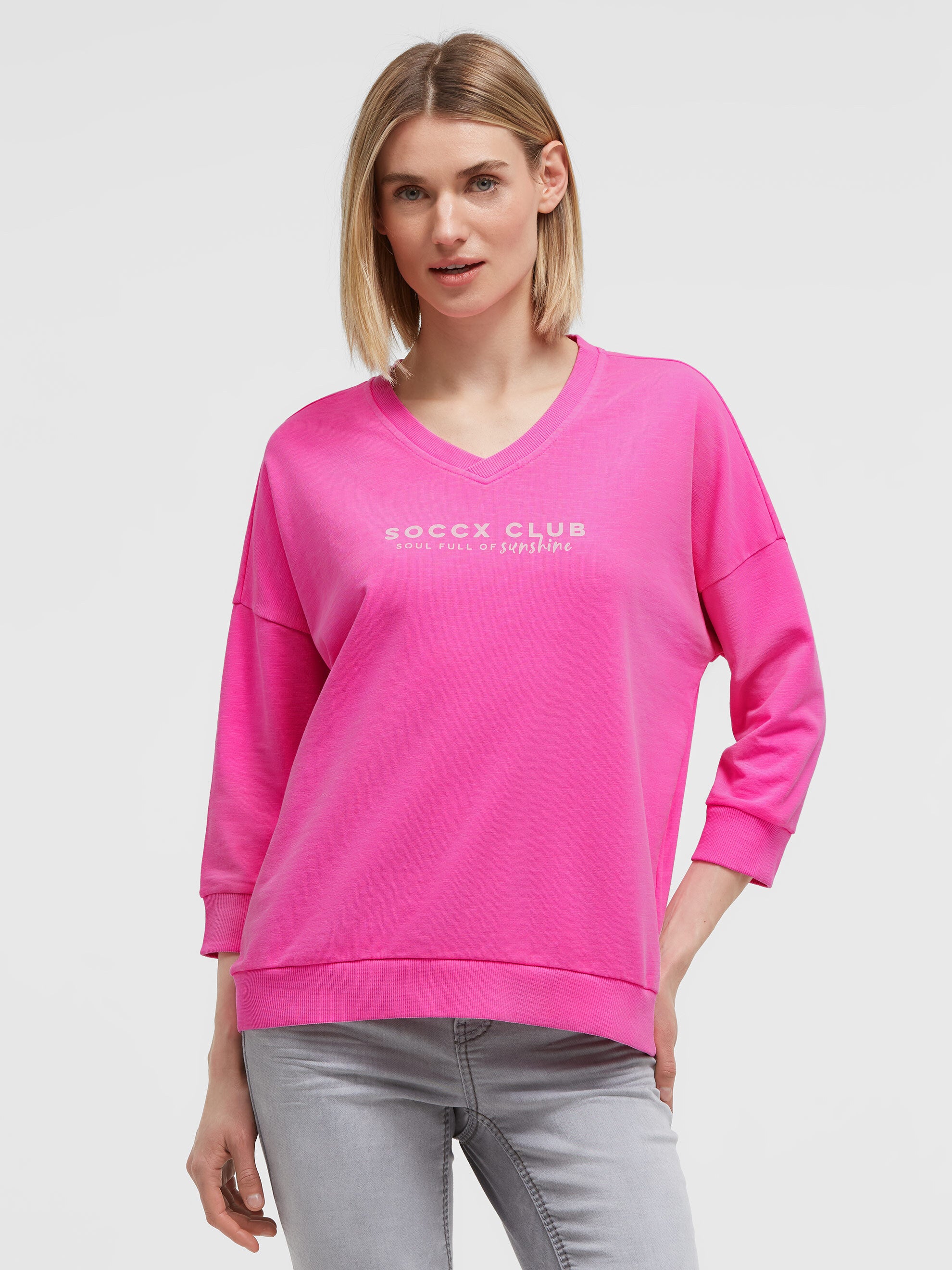 Bluza z dekoltem w serek i nadrukiem na plecach